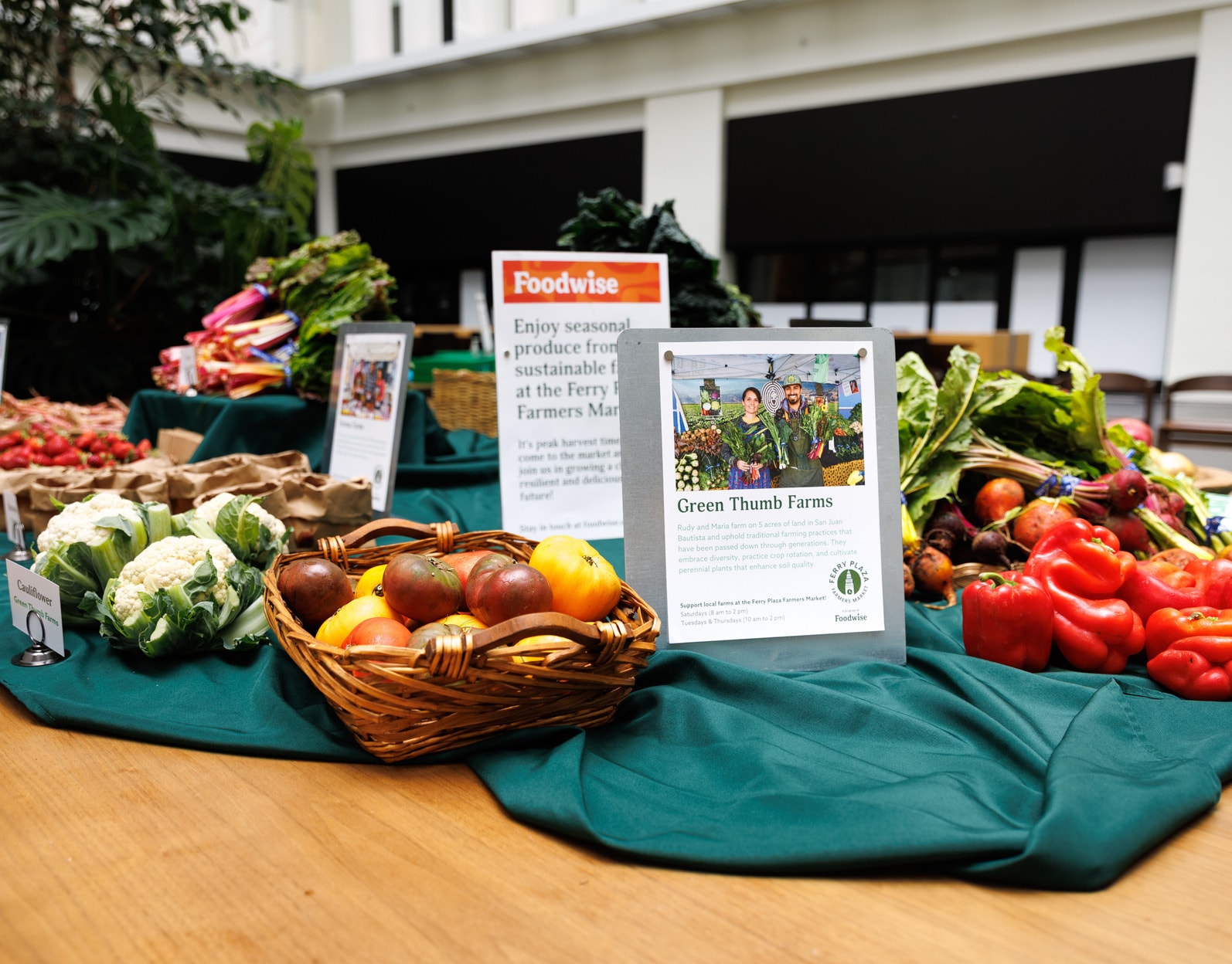 Baskets of autumn produce on the Foodwise pop-up table in the atrium