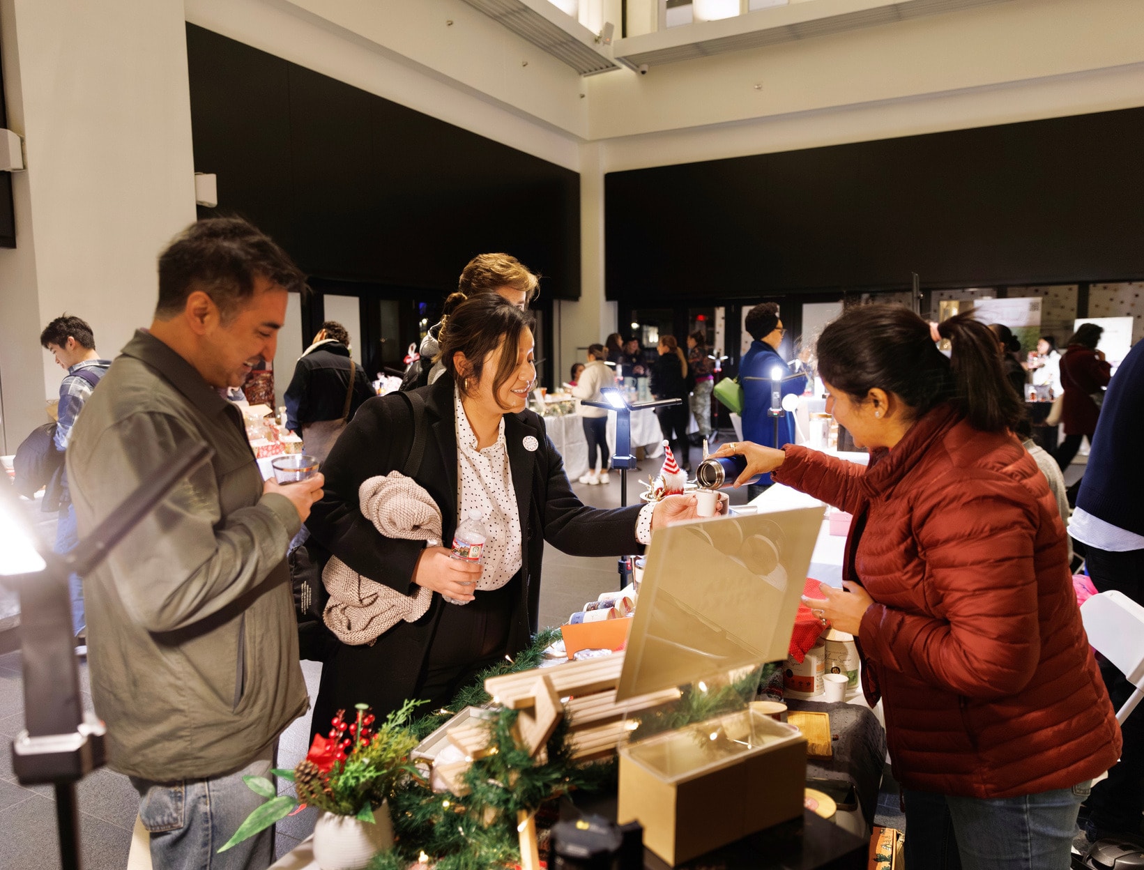 Shoppers at vendor tables during the Winter Holiday Market